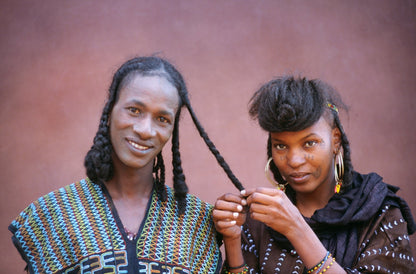 Smooth frizz-controlled hair after using African Nomads hair butter