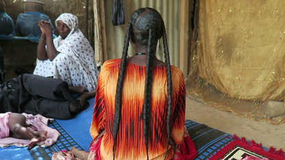 Woman showing long hair after chebe powder 100g treatment